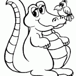 ציפור יושבת על אפו של תנין